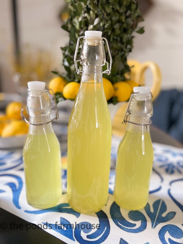 Limoncello Recipe stored in decorative bottles and kept in freezer.