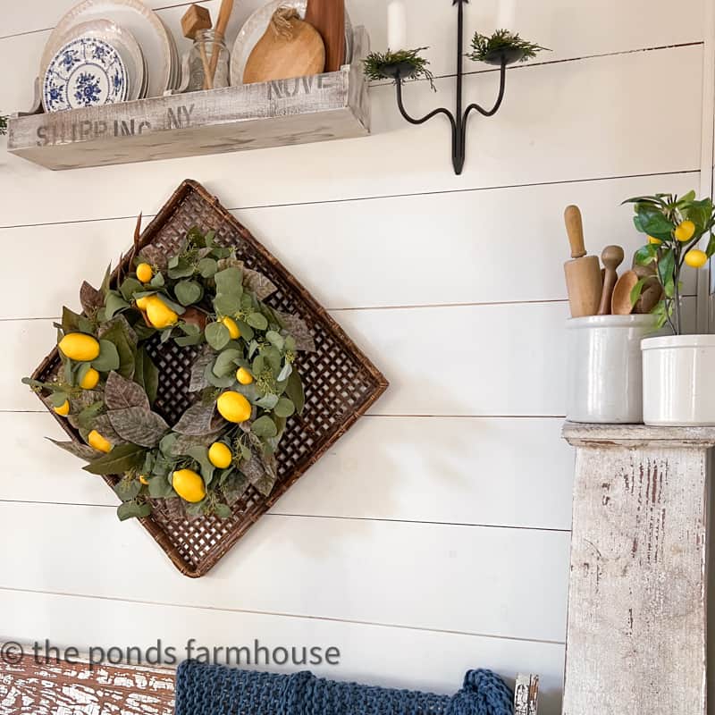 Updated DIY Spring Wreath on woven wall basket for a fresh Italian Dinner Party Idea.  