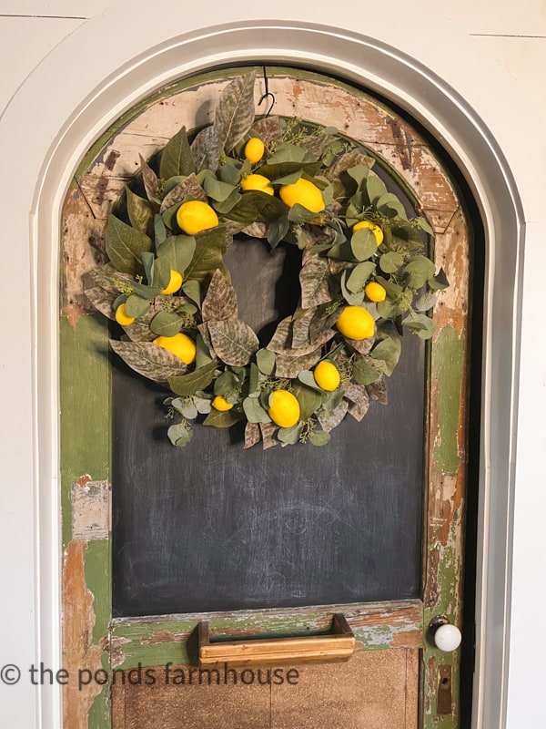 Spring Wreath DIY Update Ideas.  Add wreath to DIY pantry door in farmhouse.