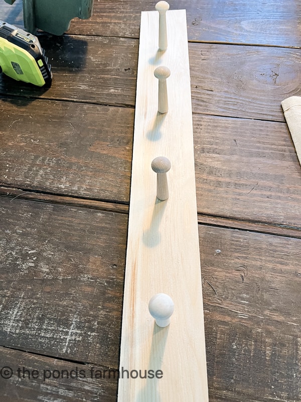 Make a shaker peg rail to attach to the shelf