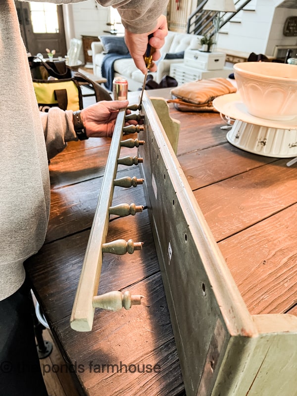 Removed decorative trim to make a Peg Rail with shaker pegs