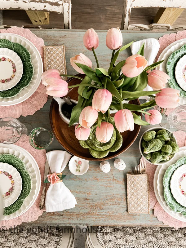 Pink tulips in a wood bowl for Beautiful Tablescape for Spring Ideas. on the screened porch.
