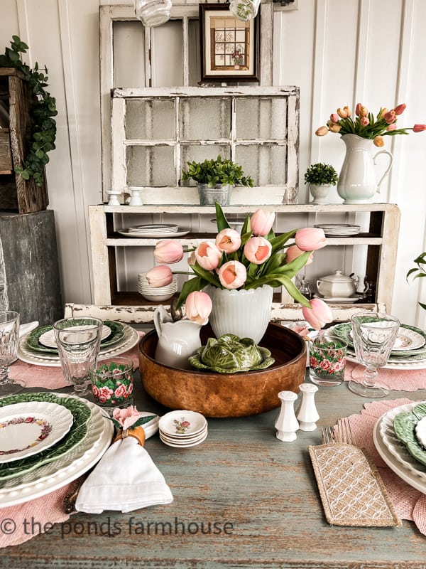 Table Setting Ideas for Spring with wood bowl centerpiece filled with tulips in milk glass vase and ironstone pitcher