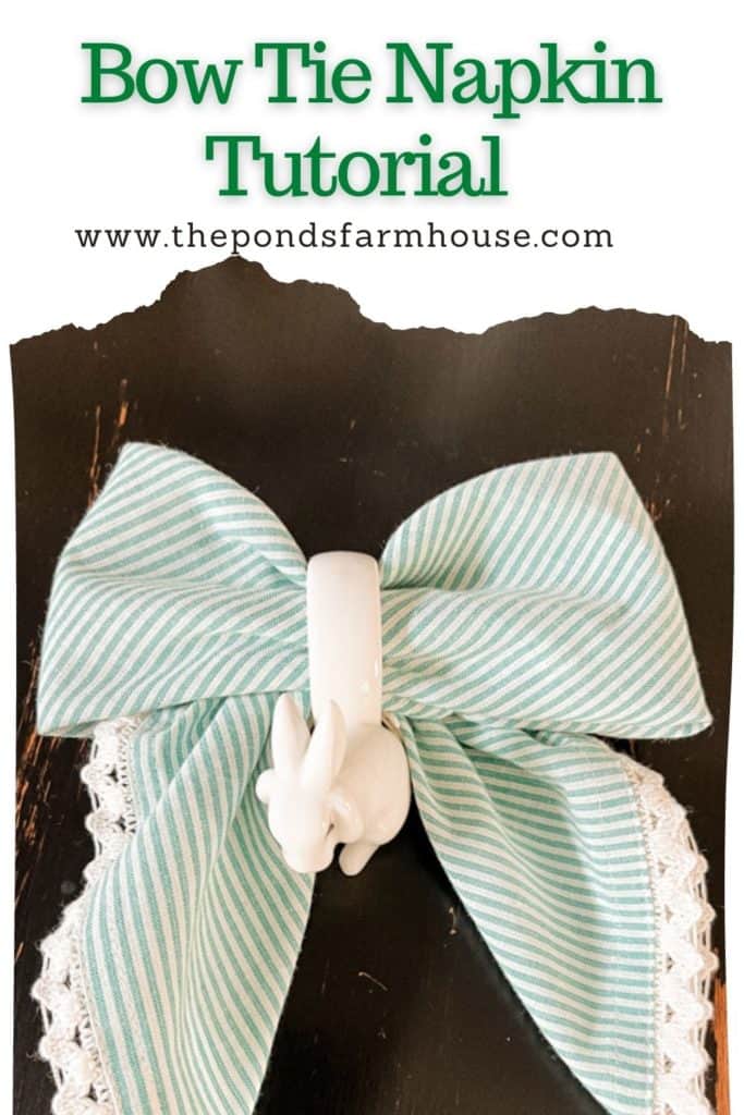 Bow Tie Napkin Fold Tutorial with striped napkin with a napkin ring for a Spring or Easter Tablescape.
