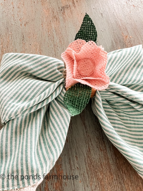 DIY Burlap Napkin rings in Pink and Green with a bow tie napkin in blue and white stripe.