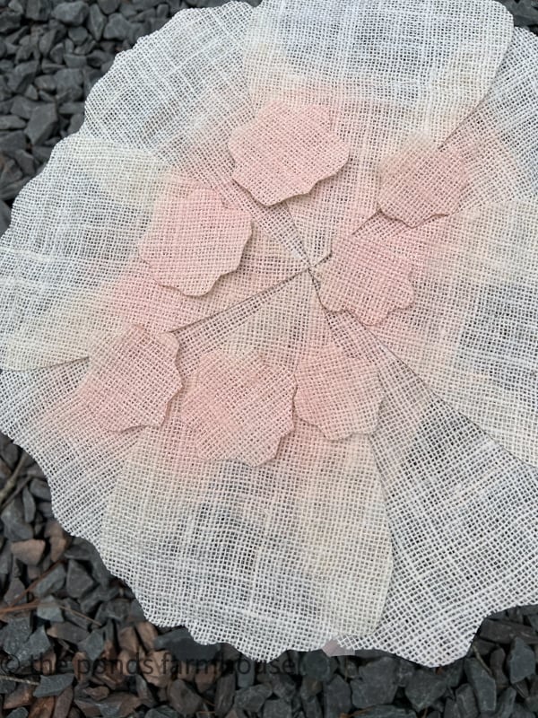 Spray paint the petals with Pink paint to make DIY Burlap Napkin Rings for Spring Tablescape