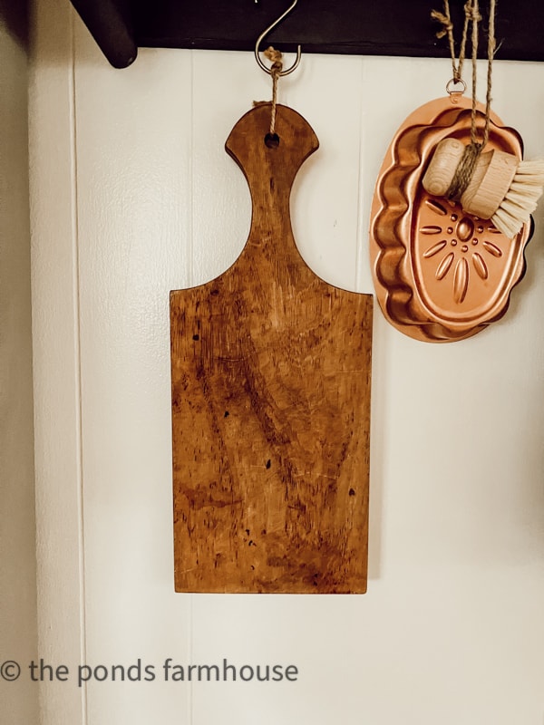 Thrifted Coastal Farmhouse Decor ideas . Thrifted wooden cutting board. and copper mold