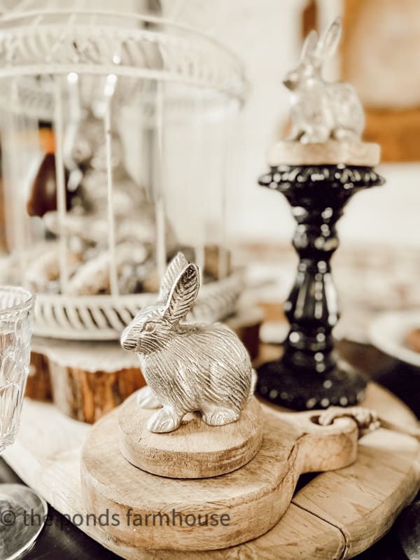 pewter bunnies for decorations for Easter Table. Vintage wooden paddles with Easter bunny table setting.