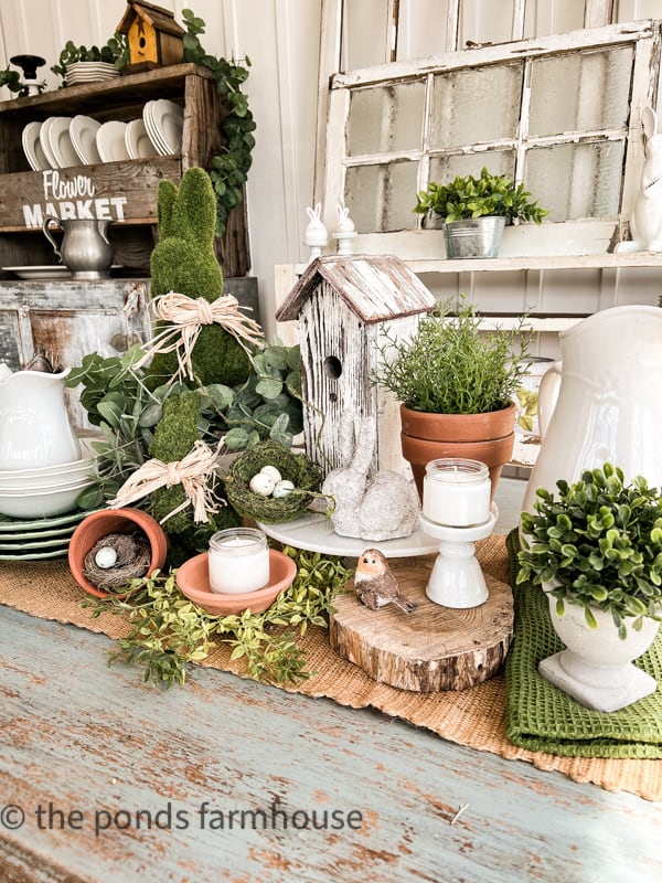 Woodland themed Easter Centerpiece, bird house with bunnies and birds.