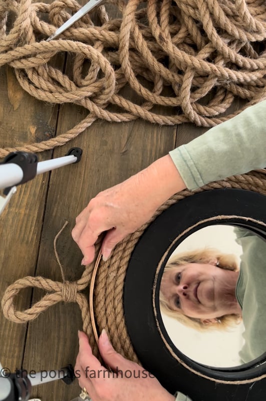 Make a loop with rope to hang the nautical mirror