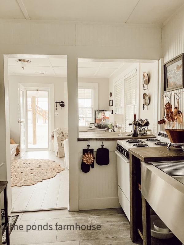 Half wall opened during beach cottage remodel creates more light and open feel to the 1940s cottage