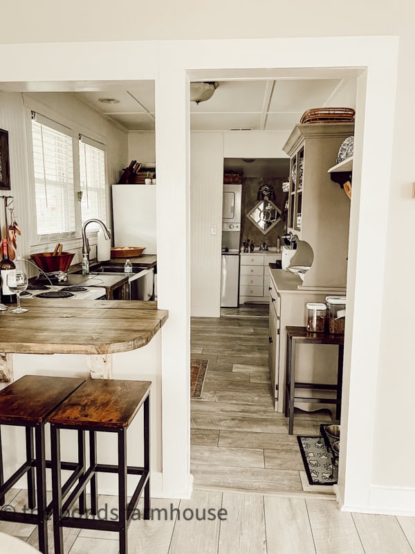 Create a kitchen island by removing a partial wall to create a eat-in bar.  