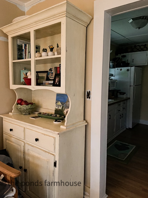 Before photo of the eat-in bar area and hutch that is now in the kitchen.  