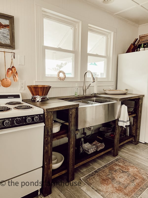 Tiny House Beach Cottage Remodel with open kitchen cabinets and apron front sink.  Farmhouse style coastal cottage.