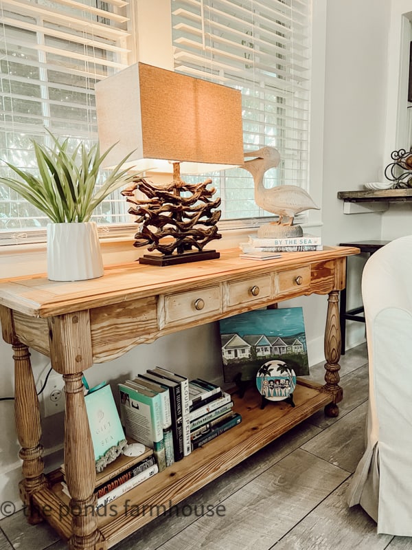 Console Table in Tiny Beach Cottage was a thrifted find for a coastal farmhouse decor