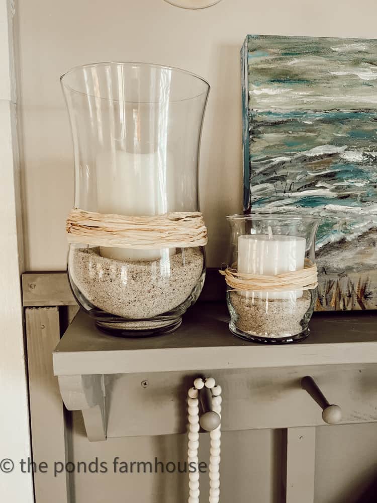 DIY Pottery Barn hack using thrifted vase, raffia, beach sand, battery operated candle. 