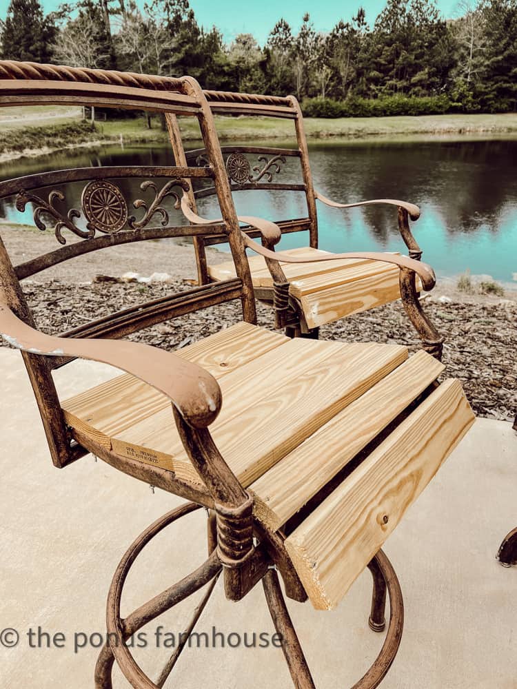 Wooden seats on outdoor bar stools.