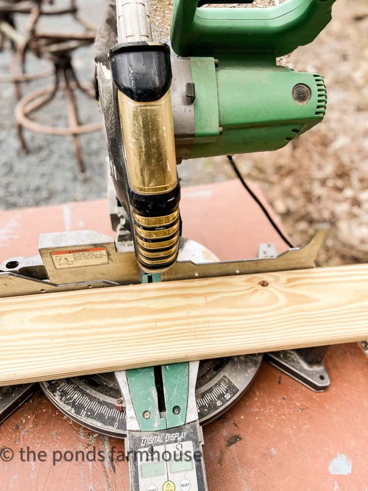 Cut lumber to fit with a miter saw.