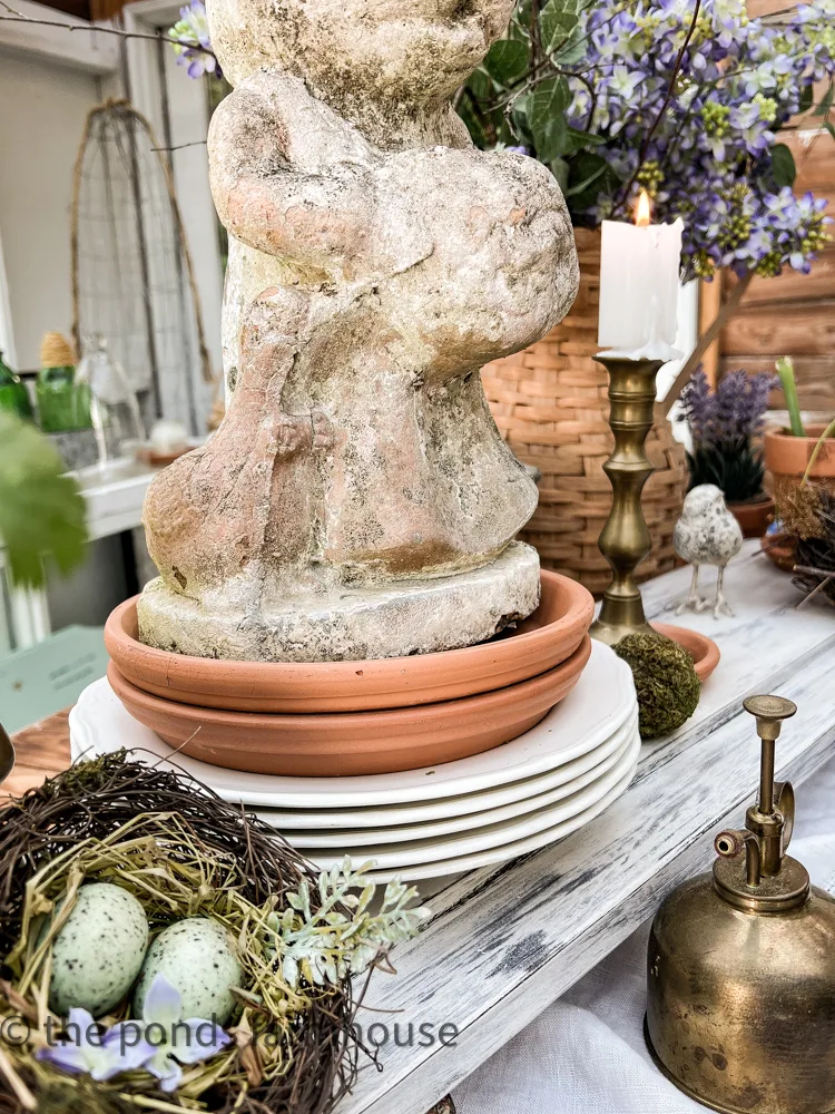 Stacks of dishes raise the elements in the centerpiece