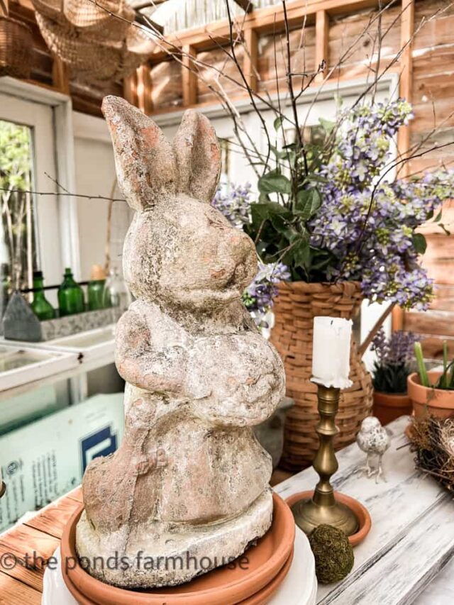 Greenhouse tablescape with vintage basket and bunny.
