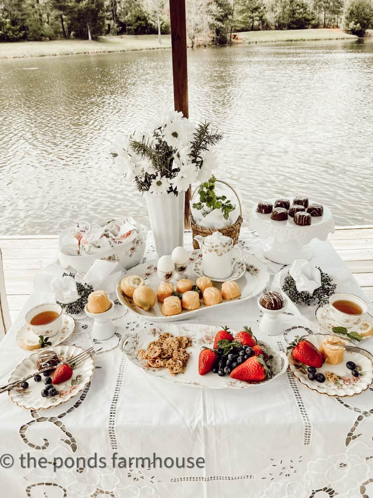 Table Set for Tea Party. Tea party by the water. Lite finger foods