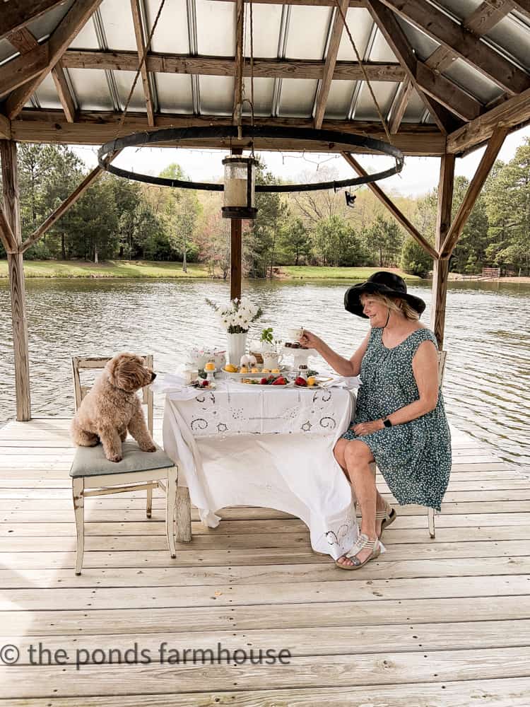 Rudy and I on the pier for a tea party. Outdoor tea party. Golden doodles 