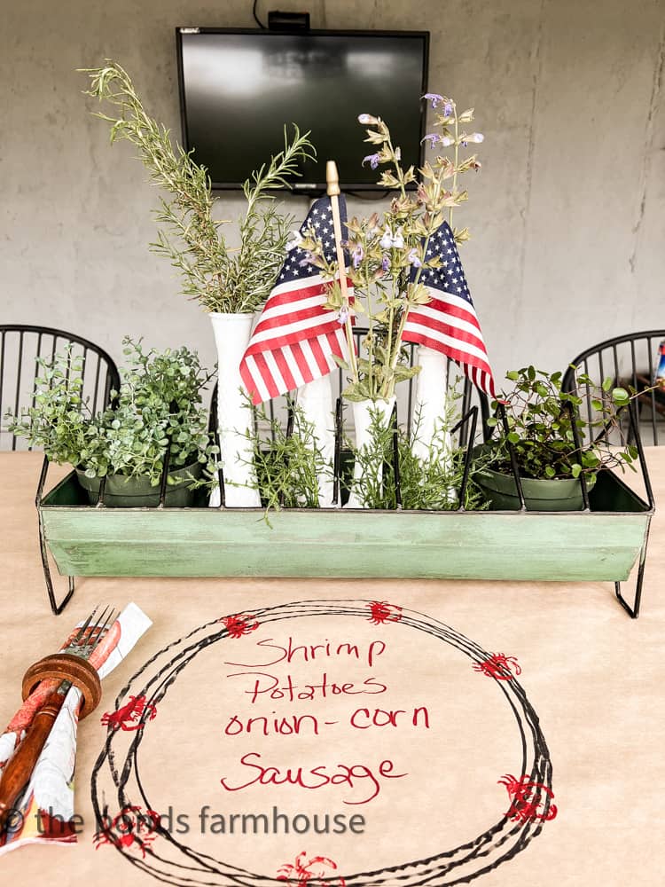 Flags and milk glass mixed with herbs for a fun centerpiece