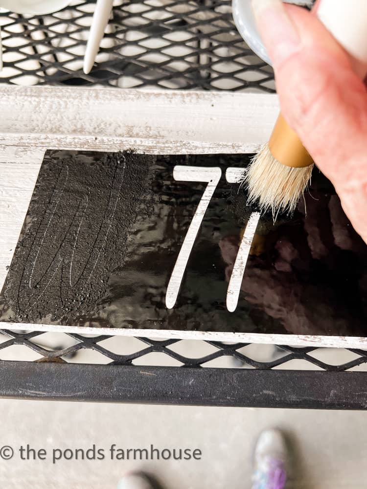 Use a stencil brush to paint the numbers. Transfer number stencils to wood.