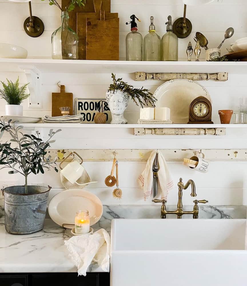 Add a peg rail under the shelves.  Shelved filled with vintage finds and kitchen wares. 