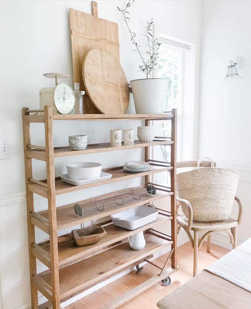 bakers rack open shelving option filled with ironstone, breadboards and a vintage scale. 