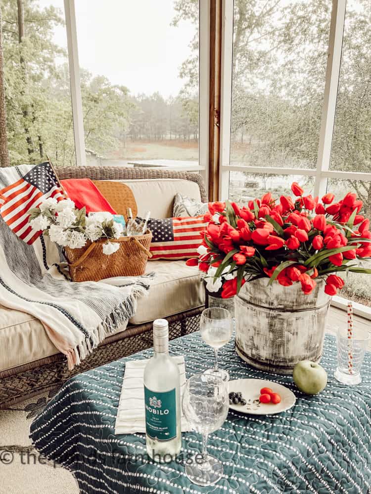 Use throw blankets, quilts and patriotic pillows to decorate for your picnic