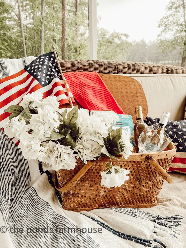 Pack your vintage picnic basket with white florals and a flag