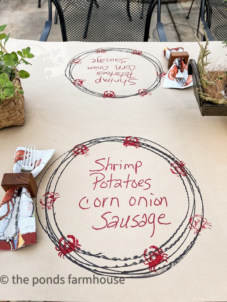 DIY kraft paper table runner for a low country boil party with menu on the table runner.  