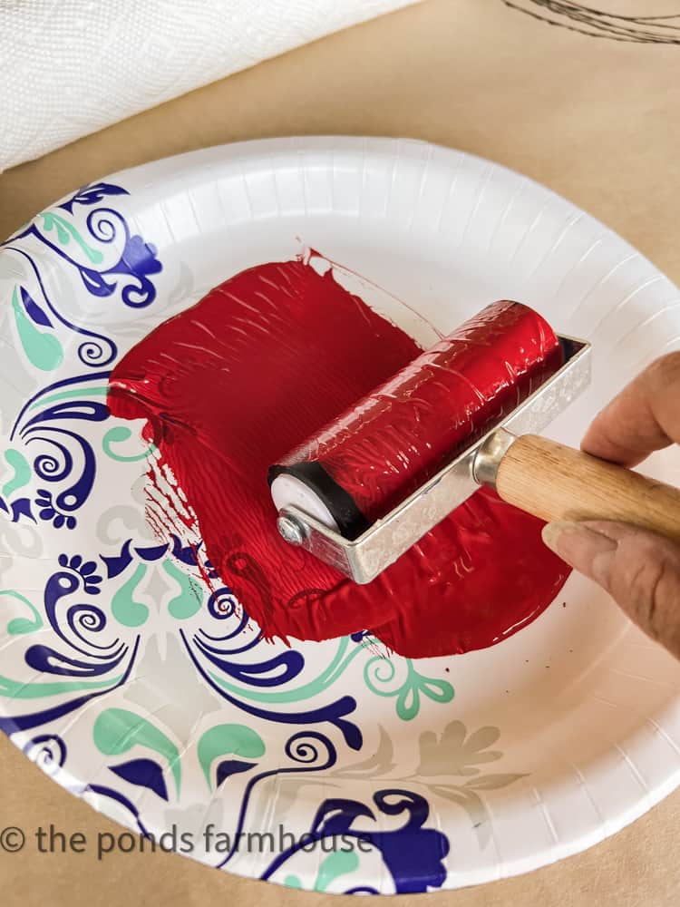 Flatten paint with brayer roller