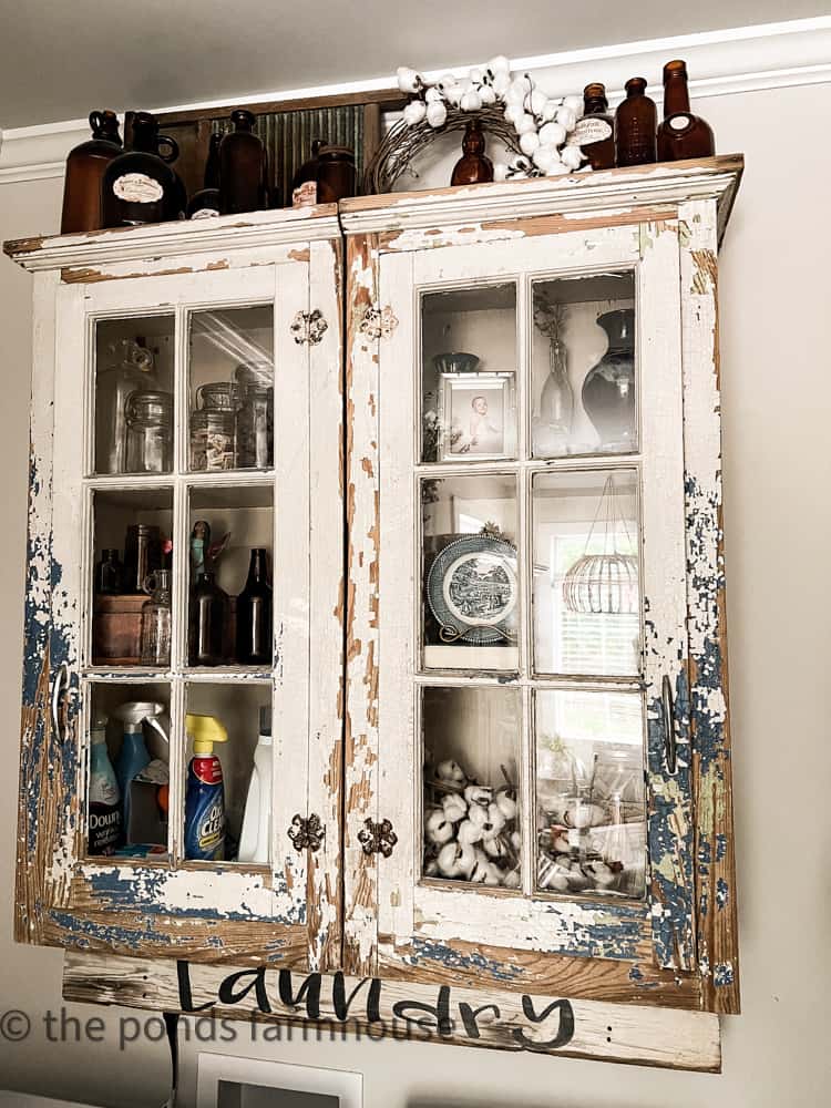 chippy vintage cabinet used in laundry room