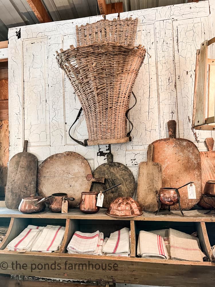 Vintage Basket, bread boards , copper and hand towels in vintage wooden box.