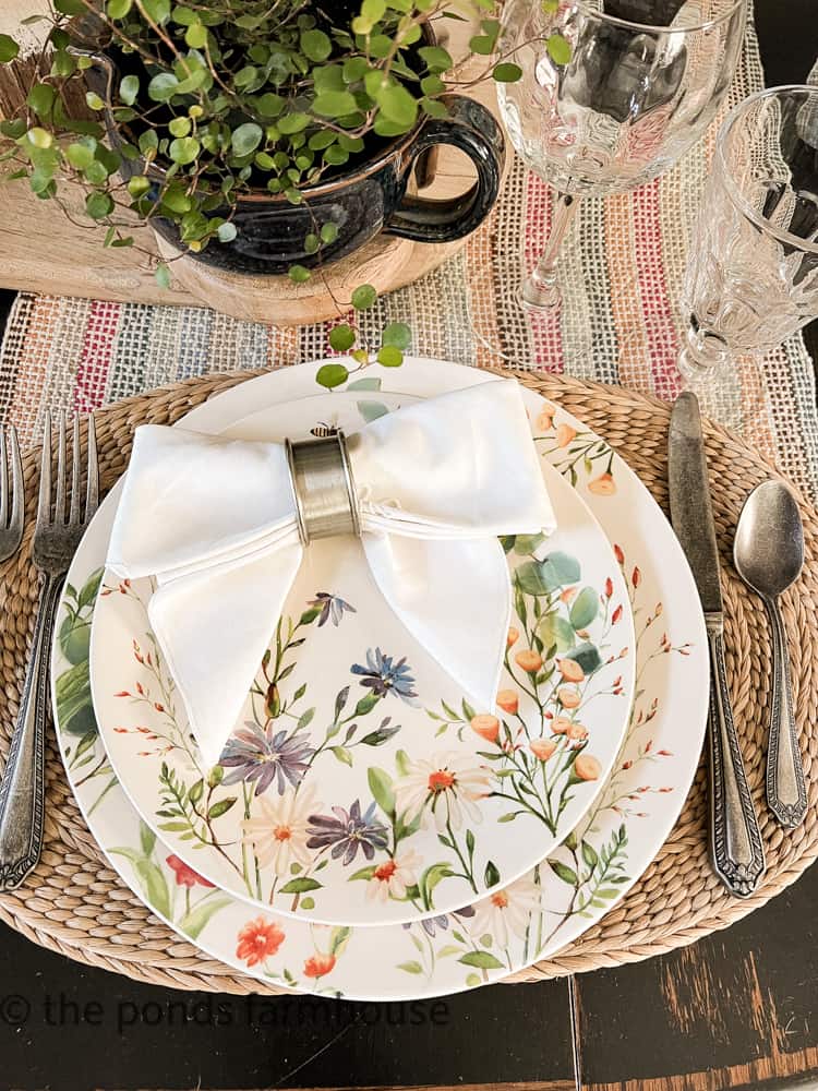 Bow Tie Napkin Fold, bow tie napkin and napkin ring beautiful place setting of floral dishes.
