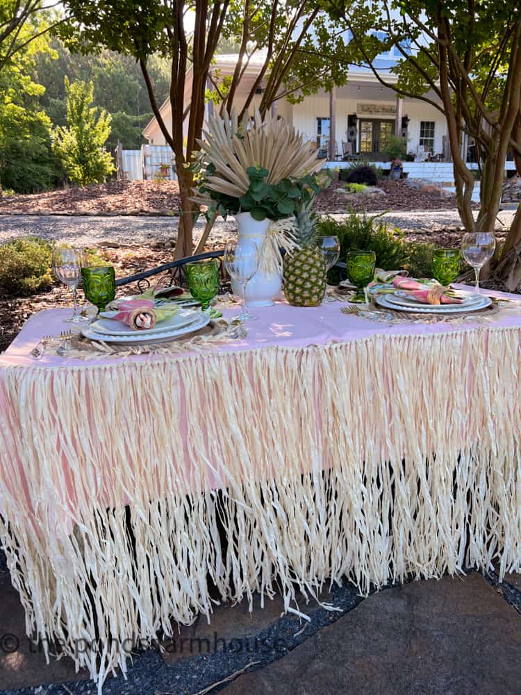 Grass Skirt for the table at a Luau Party , Hawaiian tablescape and Budget Luau Table Decor ideas.