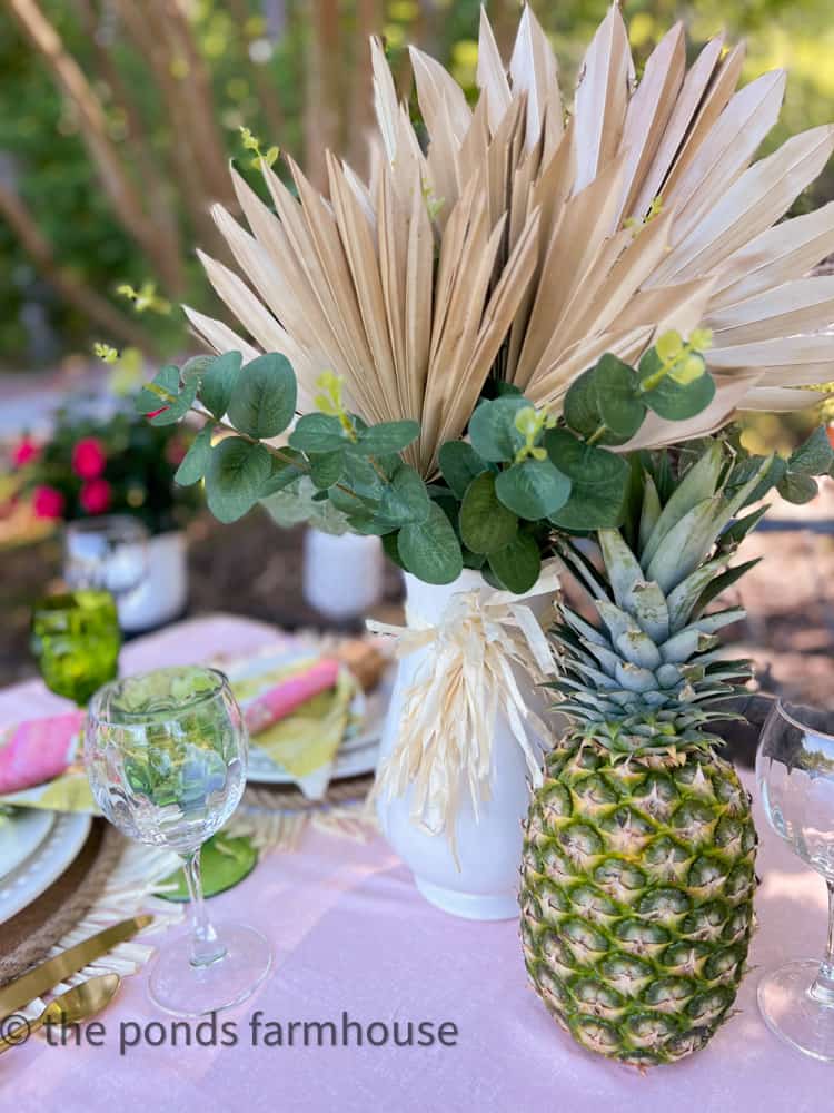 Centerpiece with pineapple and dried palms for Hawaiian Luau 