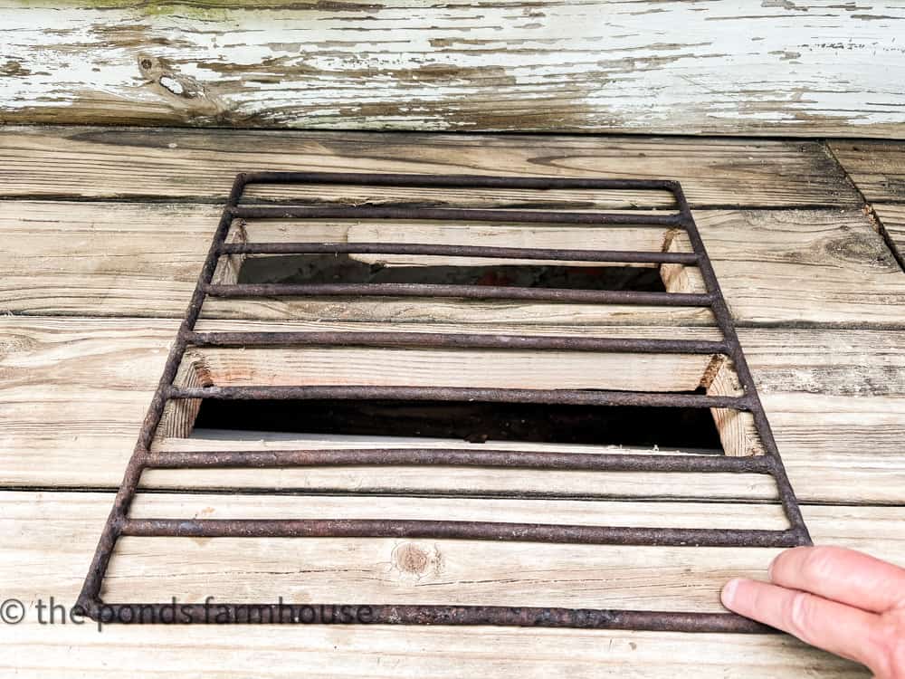 Cut Drainage Holes in Potting Bench and add a grate. Work area for potting bench watering drainage