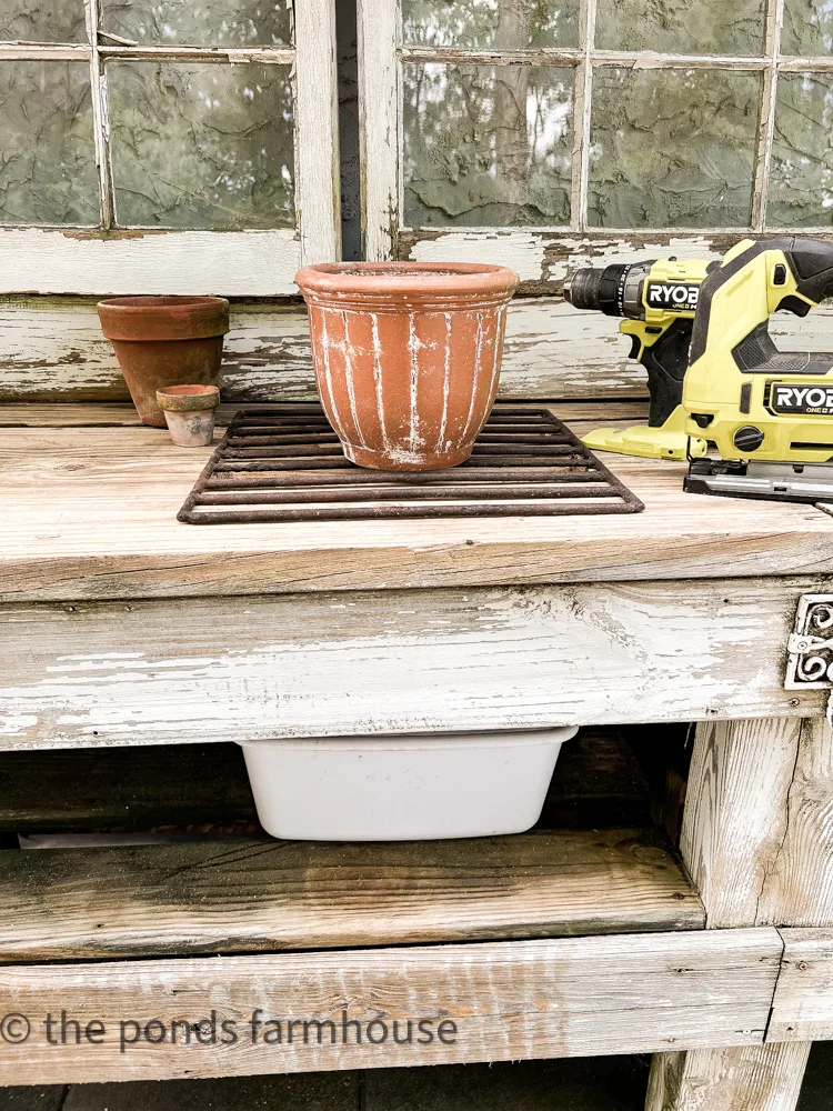 How to Make A Potting Bench More Efficient . Ryobi tools. Water catching tub for potting bench.