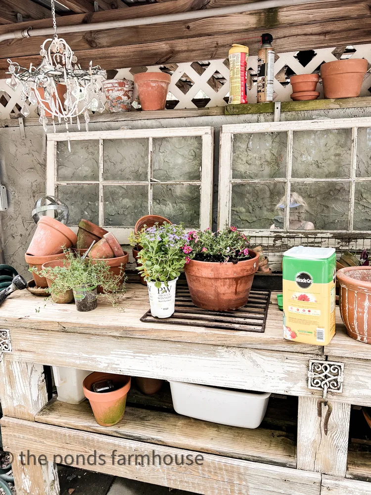 How to Make A Potting Bench More Efficient .DIY potting bench with water catching tub.
