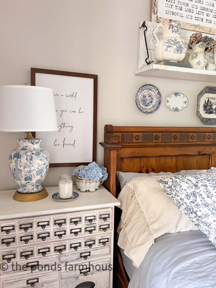 The bedroom is filled with shades of blue by adding diy blue decor.  Repurposed dresser.