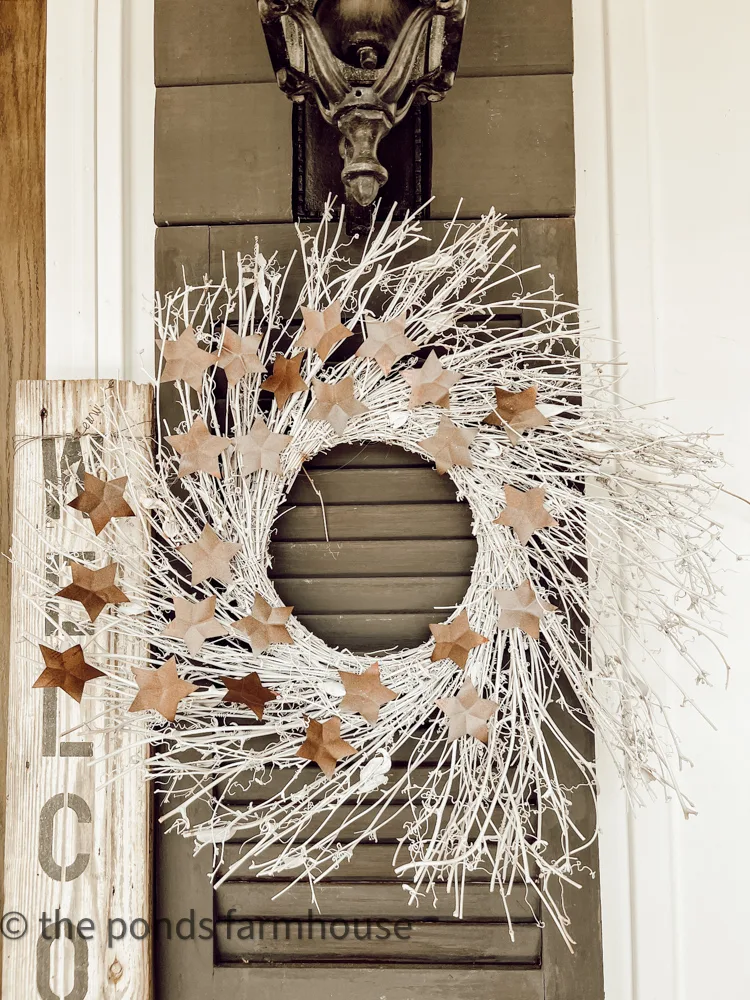Recycled aluminum cans used to make a neutral star wreath for farmhouse style patriotic decor