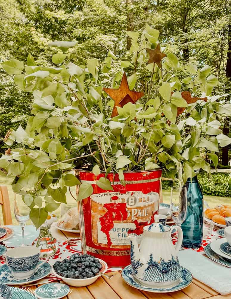 Old Bucket makes a perfect unique container for flowers.  Old bucket for centerpiece