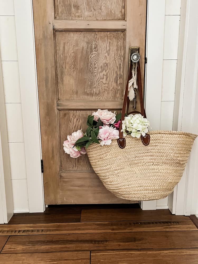 A Market Basket Tote is a great container for flowers.  Market basket filled with flowers