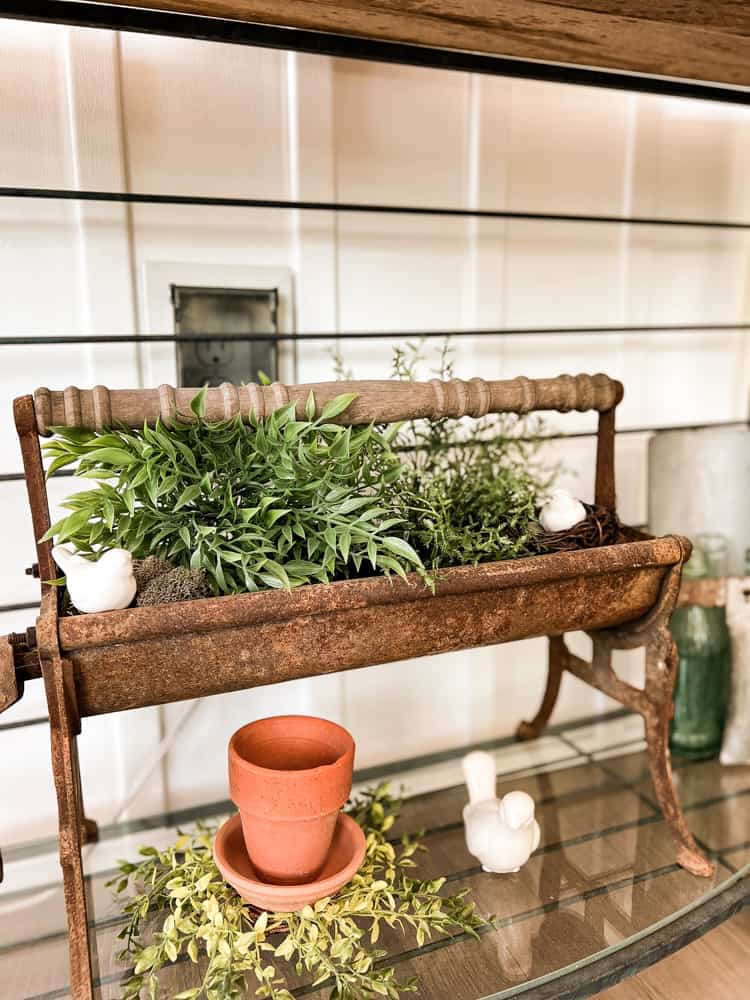 A unique flower container idea is a vintage paper roller. Planter. Trash to treasure floral container.