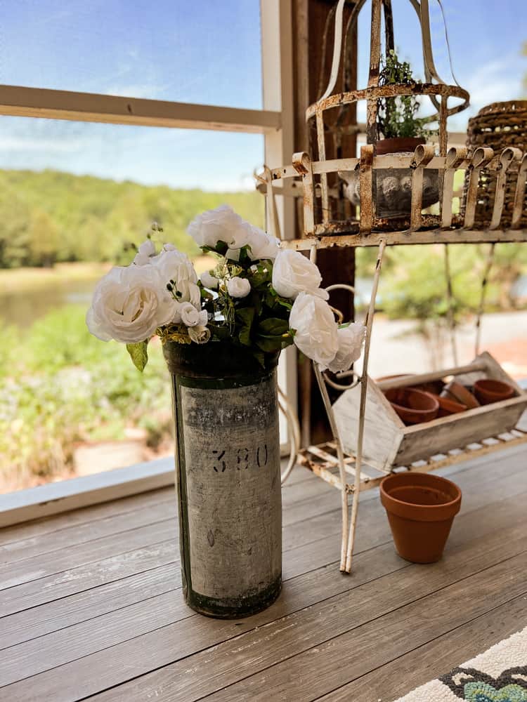 Another fun flower container ideas is this galvanized and green artillery shell for a vintage floral container