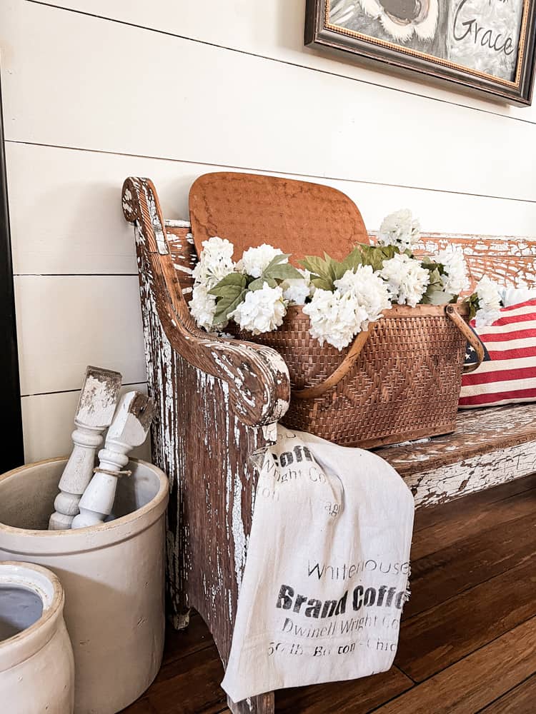 Vintage Picnic Baskets used for flower arrangement and is a fun basket decor idea.  