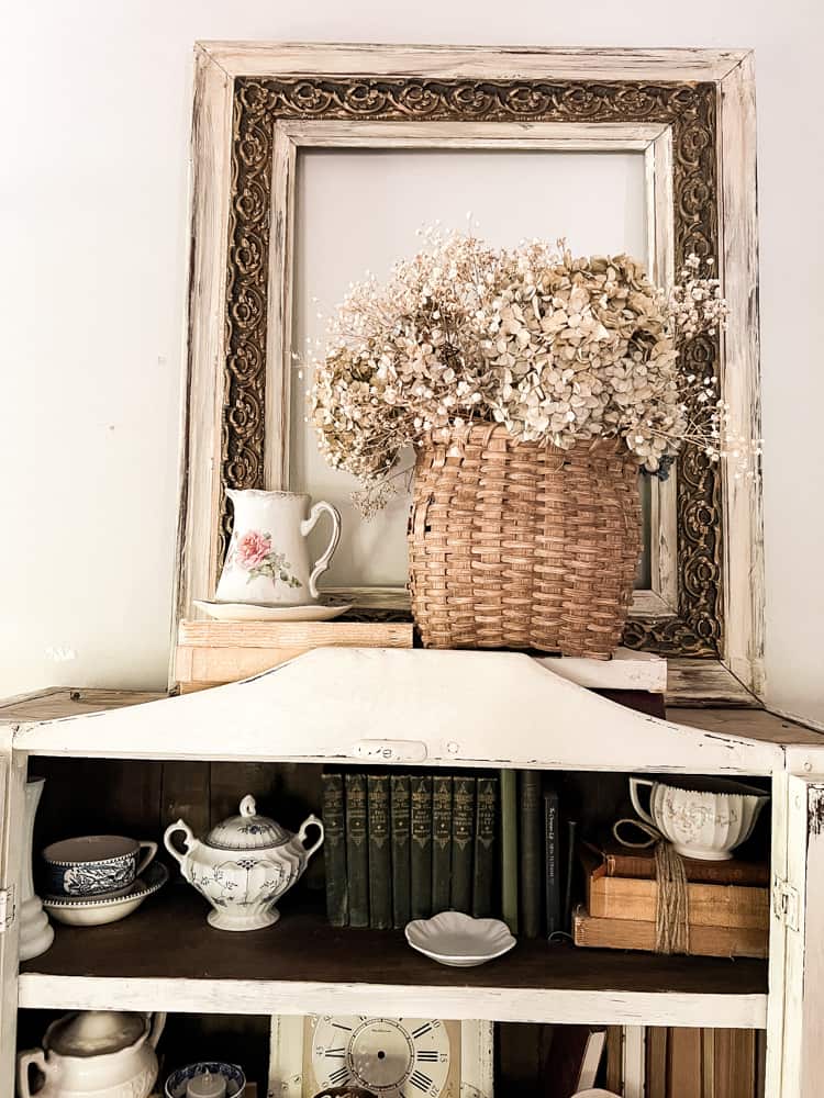 unique container for flowers is this woven basket filled with dried hydrangeas. Basket planter